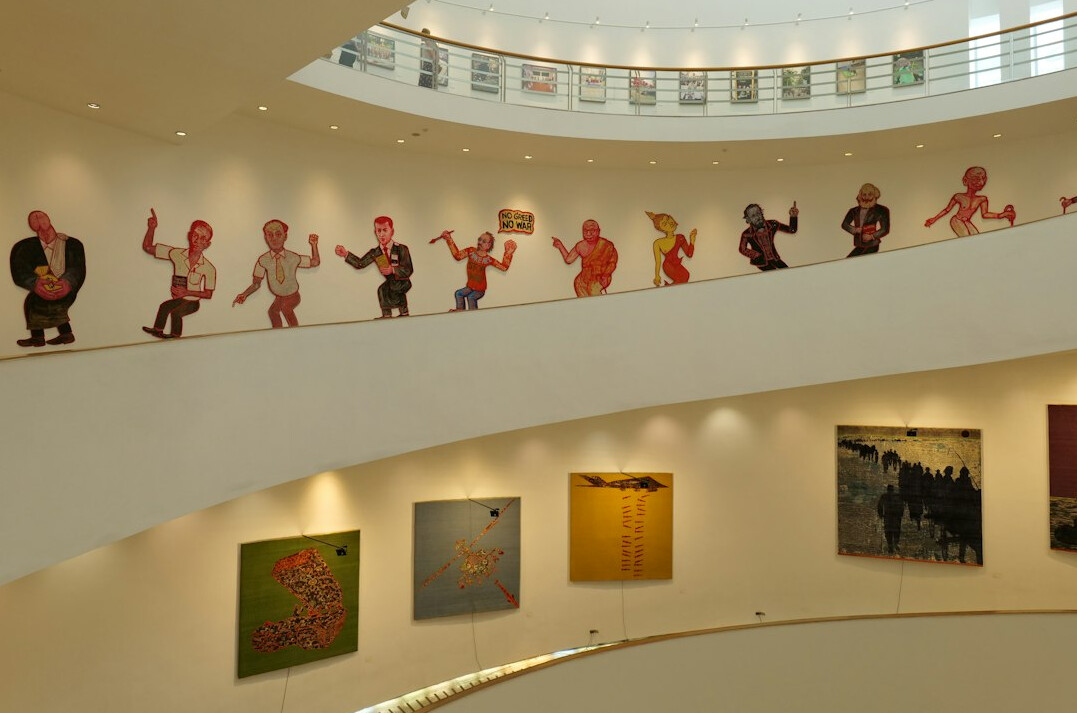 Older couples dancing together in a bright hall