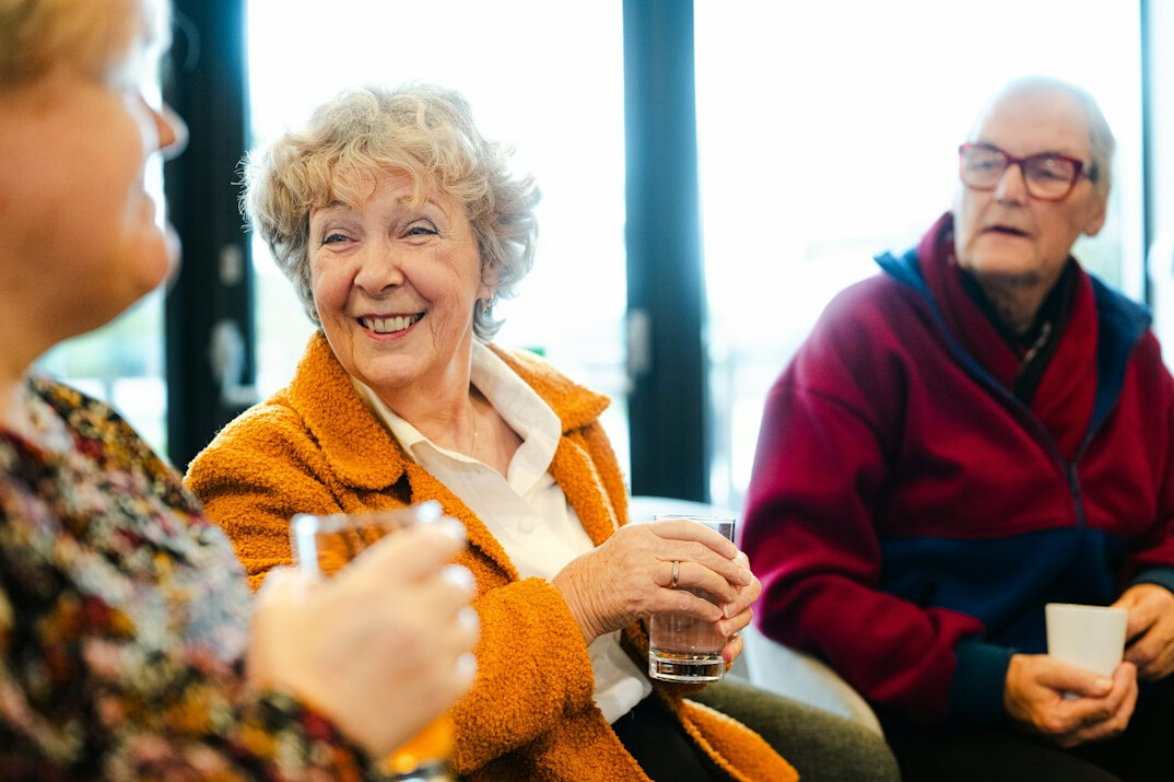 senior friends laughing together